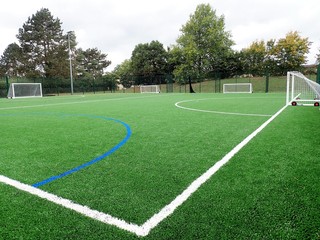 Floodlit all-weather artificial football pitch at William Penn Leisure Centre, Rickmansworth, Hertfordshire, UK