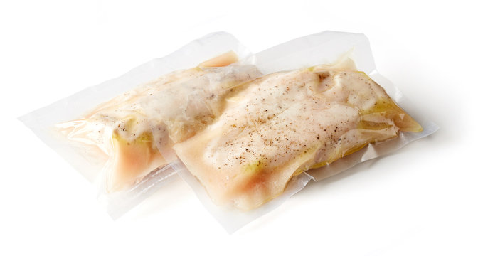 Chicken breast vacuum sealed isolated on white