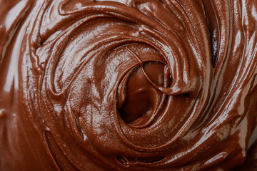 Melted chocolate swirl  background closeup
