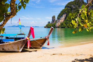 Fototapeta na wymiar Longtail Boats Moored At Aonang Beach in Thailand