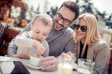 Happy family in cafe