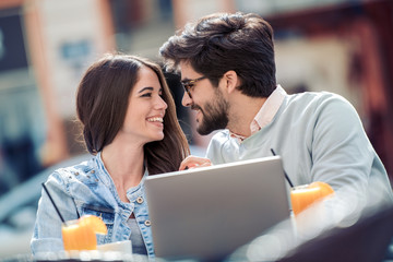 Young couple in love sitting in cafe