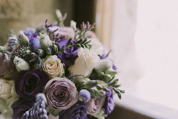 Wedding Flower Bouquet with purple coloured flowers.
