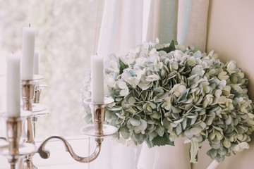 Flowers and candles in light pastel colours