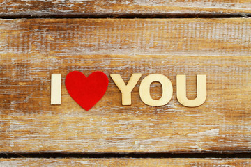 I love you written with wooden letters and red heart
