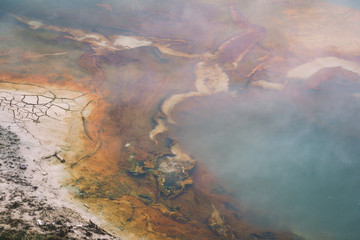 Close up photo showing texture and natural colors of a geyser thermal feature in Yellowstone National Park's West Thumb Geyser Basin