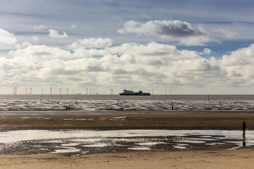Deserted beach at Crosby near Liverpool with cast iron sculptures.