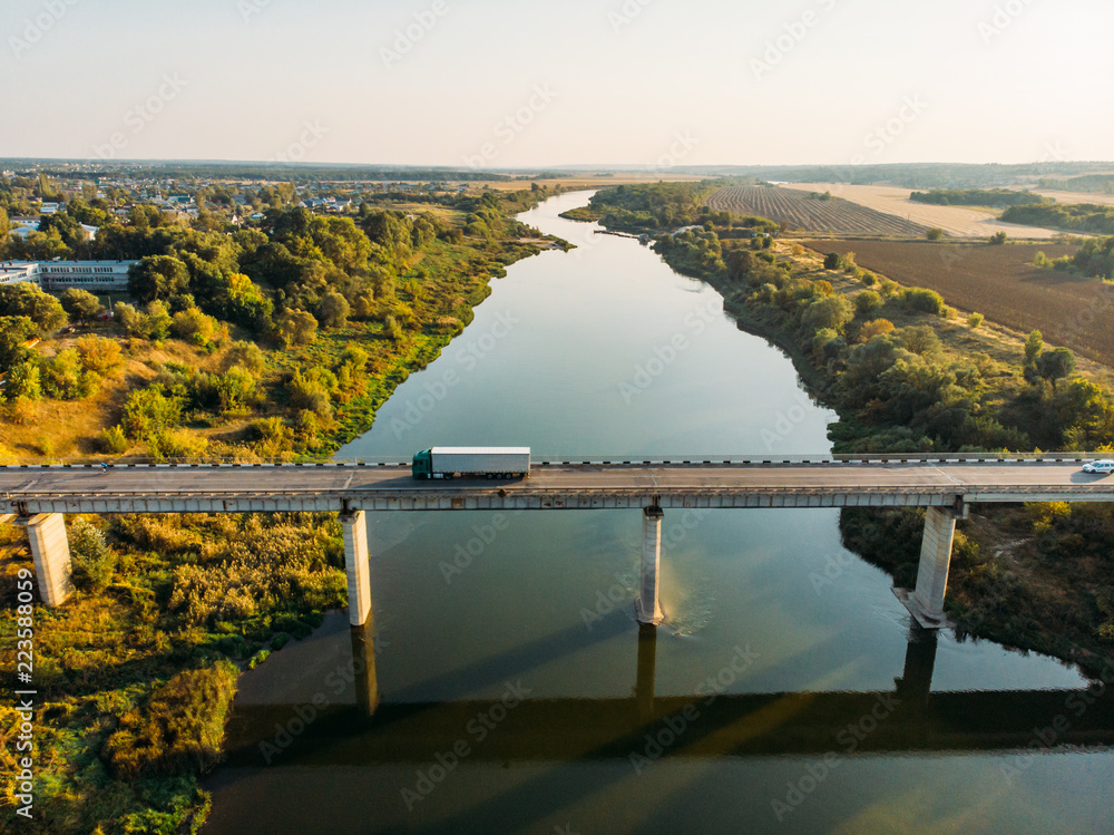 Wall mural Aerial view of bridge over Don river in Voronezh, autumn landscape from above view with highway road and car transportation