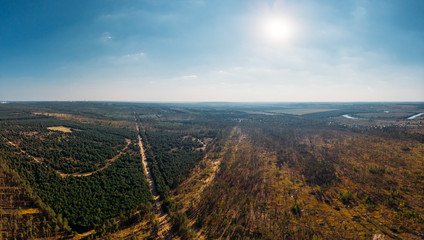 Aerial panorama view from above of nature landscape with forest and rural countryside, beautiful scenery landmark