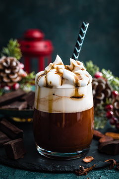 Hot chocolate with whipped cream. Chocolate drink and Christmas decorations