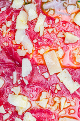 Carpaccio of ox. Raw meat cut into slices of very fine and seasoned with olive oil, lemon and orange juice, Parmigiano Reggiano cheese, oregano and Provençal herbs.