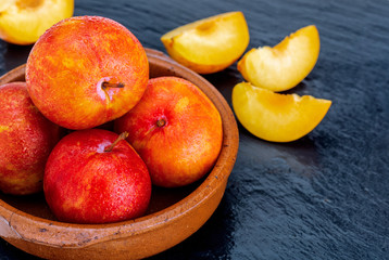 Yellow and orange plums (variety known as honey or mirabelle). Color yellow, orange, orange. Healthy diet based on fruits (detox) due to its high fiber content.