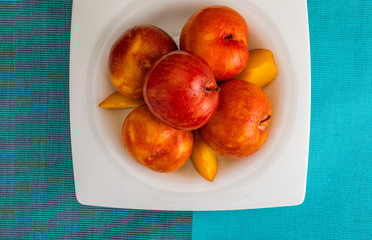 Yellow and orange plums (variety known as honey or mirabelle). Color yellow, orange, orange. Healthy diet based on fruits (detox) due to its high fiber content.