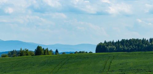 arable fields on the background of mountains in the south of Poland