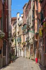 Narrow italian street in Venice, Italy