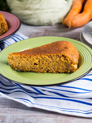 Spiced carrot cake with walnuts and cinnamon with breakfast setting background