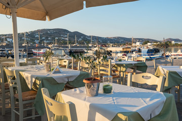 Cozy seaside outdoor restaurant in Parikia on Paros island, Cyclades, Greece