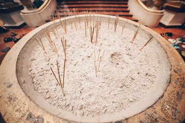 Vase with sand where all put your own stick in Siem Reap, Cambodia