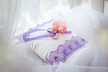 Wedding rings on a beautiful pillow