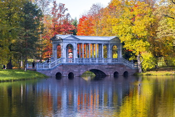 Marble bridge in autumn foliage in Catherine park (Pushkin), St. Petersburg, Russia