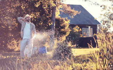 Man farmer watering a vegetable garden