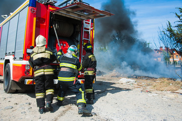 Firefighter extinguishes a fire