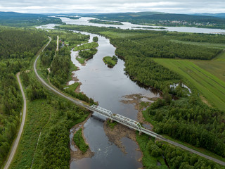 Steel railroad bridge over river in northern Finland