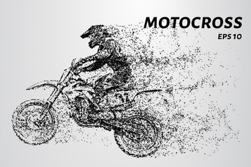 Motocross particles. A motorcyclist performs stunts