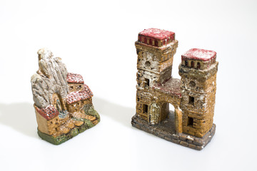 Christmas decorations, nativity scene houses isolated in a white background