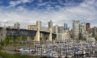 Fototapeta na wymiar View of Burrard Bridge, Fisherman Wharf and Marina from False Creek Seawall near Kitsilano in Vancouver BC