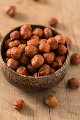 hazelnuts on wooden surface