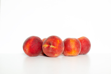 Fototapeta na wymiar Fresh peaches isolated on white backround