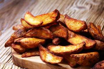 Baked potato wedges. homemade organic vegetable vegan vegetarian potato wedges snack food