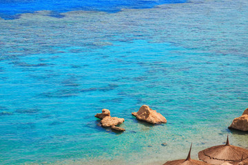 beach with coral reef and turquoise sea