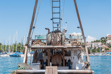 an old fishing boat is prepared to go out to sea for fishing. the quota for catching fish. small business