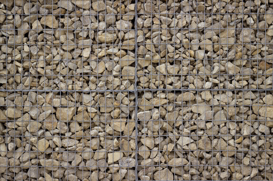 Stone wall of a gabion as a background. A popular element of design for a garden