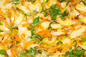Cabbage stewed with herbs.Background of stewed cabbage with parsley and dill.
