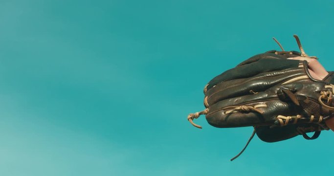CU of a baseball glove catching a ball. 4K UHD 60 FPS SLO MO RAW