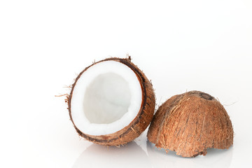 Cut coconut on white background.
