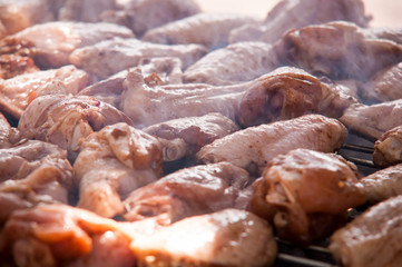 Grilled chicken legs on the grill .