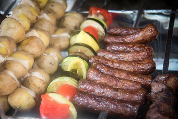 Potatoes and lard, vegetables and grilled sausages.