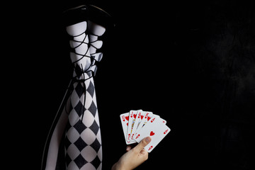 girl with tights holding play cards - royal flush