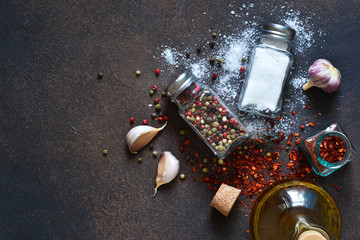 Mix of spices: pepper red, black, white, salt and paprika on a concrete background. Food background...