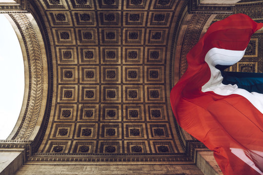 Low angle view of flag of France in Arc de Triomphe