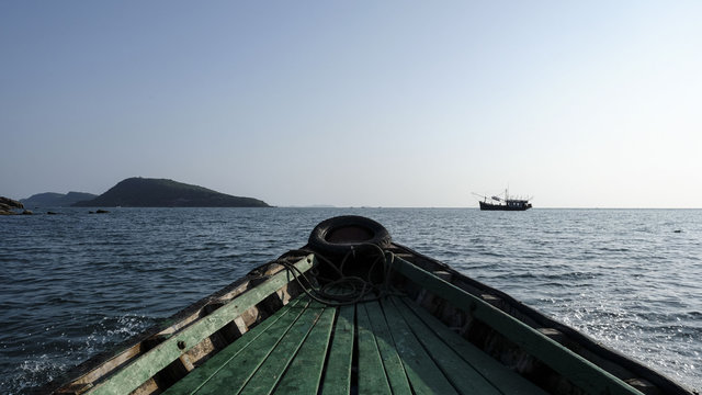 Wooden Boat Sailing In Sea Against Clear Sky