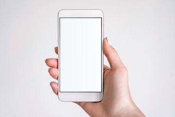 Female hand model with white mobile phone with white screen on isolated background.