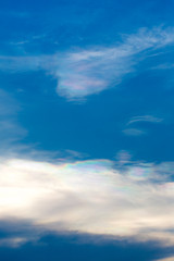 The sun shines on the sky from airplane, View on flight, bird eye view.Over the Clouds. Fantastic background with clouds and mountain peaks.rainbow on the cloud. rainbow in the heaven.