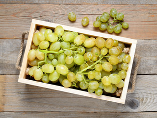 Grapes in wooden box top view