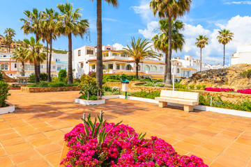 White houses and colorful flowers in small coastal village near Marbella, Costa del Sol, Spain © pkazmierczak