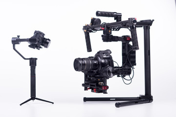 Systems stabilization video camera and lens on steady equipment support such as gimbal steady or stabilized. White background.